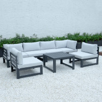 LeisureMod CSTBL-7LGR Chelsea 7-Piece Patio Sectional And Coffee Table Set Black Aluminum With Cushions