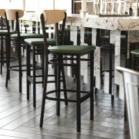 Flash Furniture XU-DG6V6GNV-NAT-GG Wright Commercial Barstool with 500 LB. Capacity Black Steel Frame, Natural Birch Finish Wooden Boomerang Back, and Green Vinyl Seat