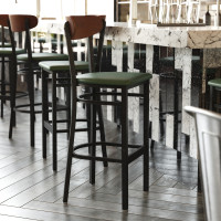 Flash Furniture XU-DG6V6GNV-WAL-GG Wright Commercial Barstool with 500 LB. Capacity Black Steel Frame, Walnut Finish Wooden Boomerang Back, and Green Vinyl Seat